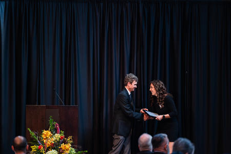 Student receives her award onstage