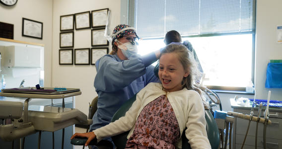 School of Dentistry providers with a child patient in Hibbing, Minnesota.
