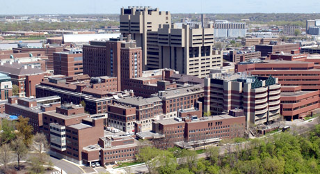 A skyward view of the east bank campus with the Moos Towers in focus in the center