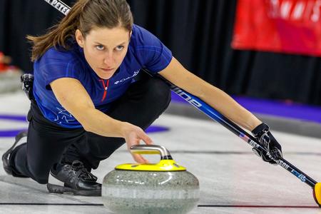 Tara Peterson competing in curling