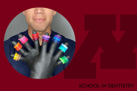 Photo of Grant Collins holding up braces rubber bands of various colors on each gloved finger, on a School of Dentistry branded background