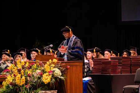 Mays speaks and applauds at graduation