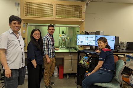 Fok, Zhang, Lima and Chew pose in their lab