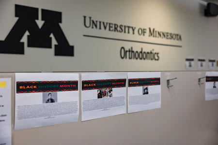 Black History Month signs on the walls of the UMN Orthodontics clinics