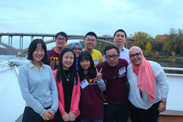 student researchers pose with Mississippi river in background
