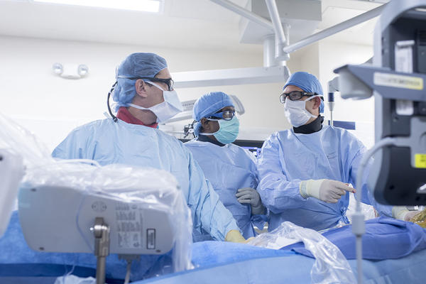 MHealth operating room with doctors consulting each other
