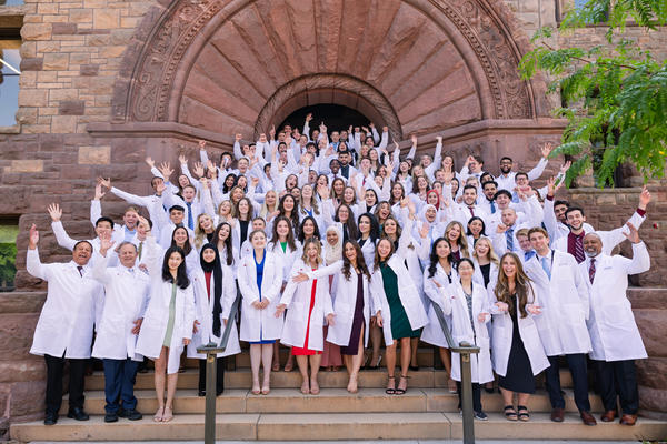white coat ceremony on the steps of a historic building