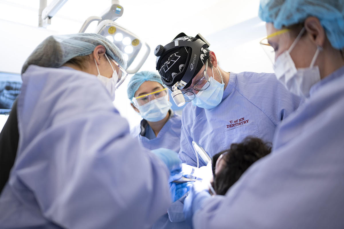 The oral and maxillofacial surgery team perform treatment on a patient