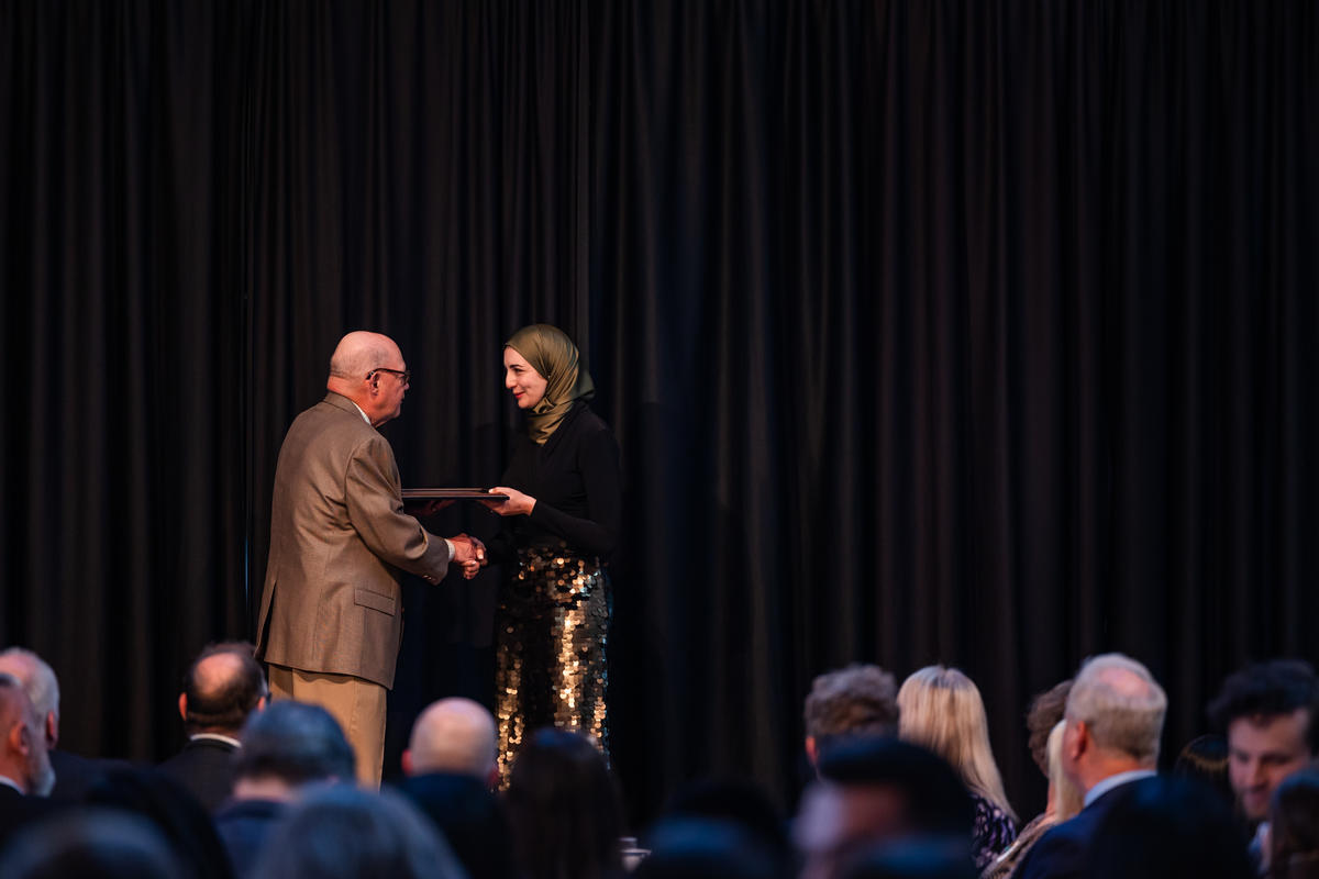 A student receives their award onstage