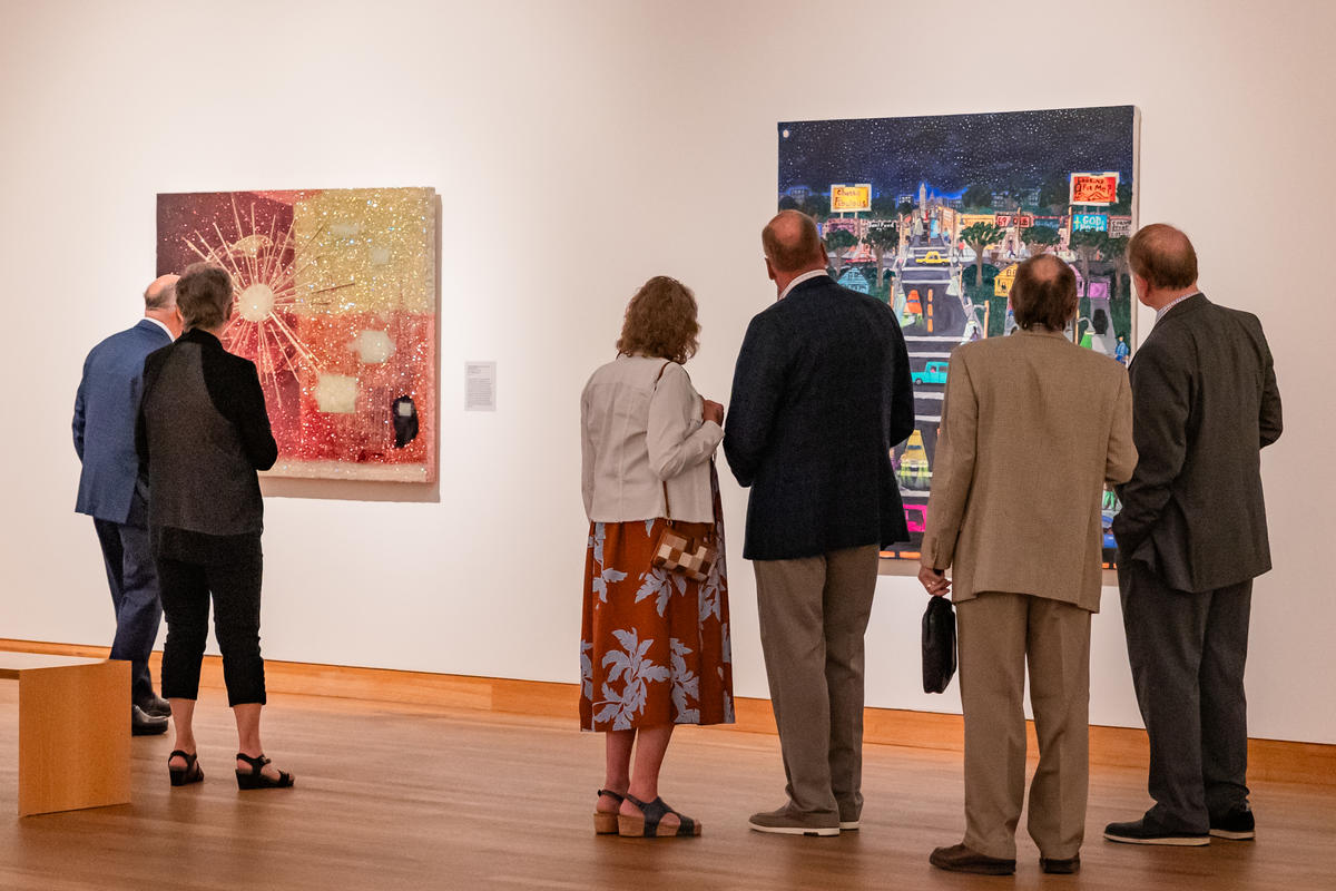 Attendees enjoy art at the Weisman Art Museum