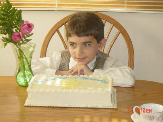 Alex Tabatabai as a young child with birthday cake