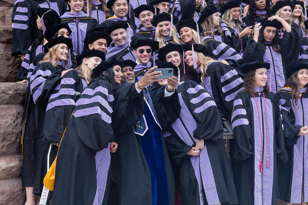 Students taking picture at commencement.