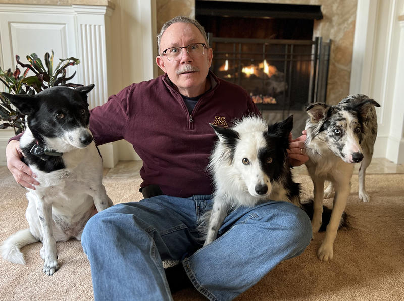 Photo of Scott McClanahan surrounded by three dogs