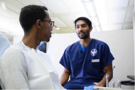 Student talking with patient